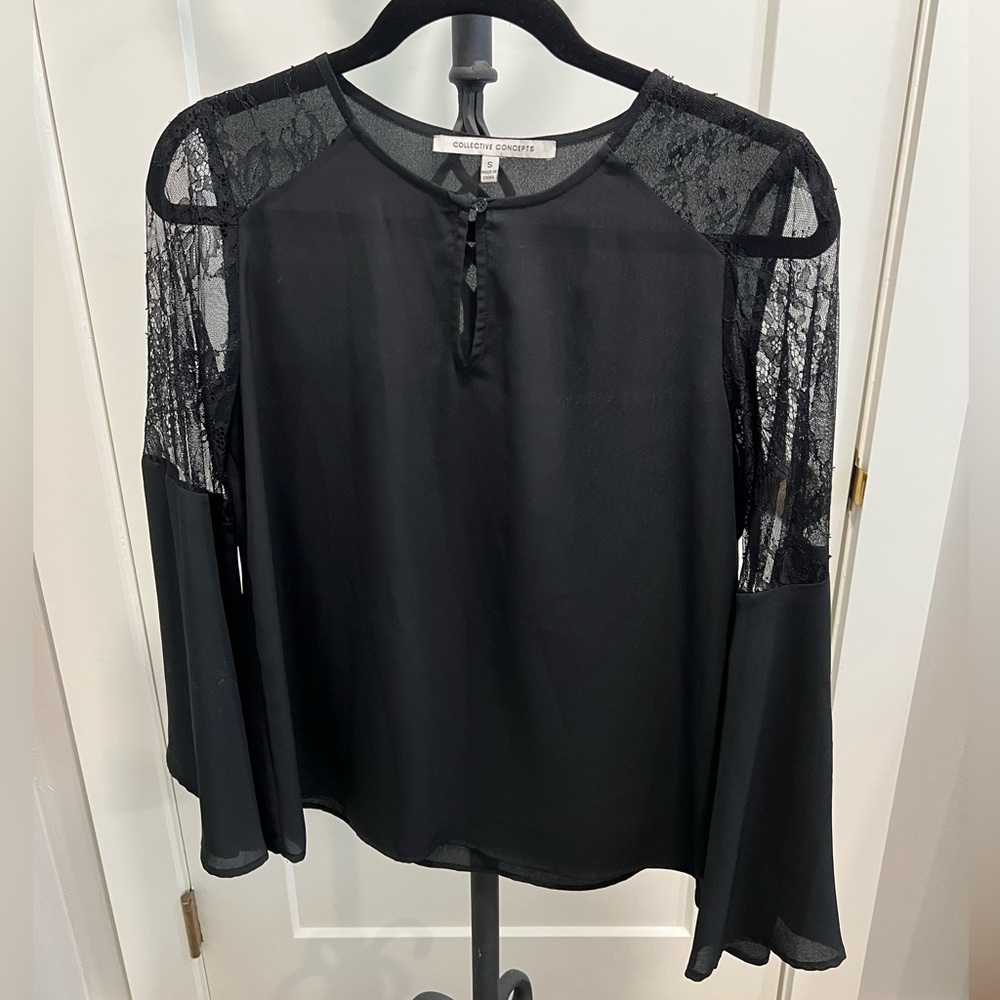 Black blouse with lace accent and bell sleeve